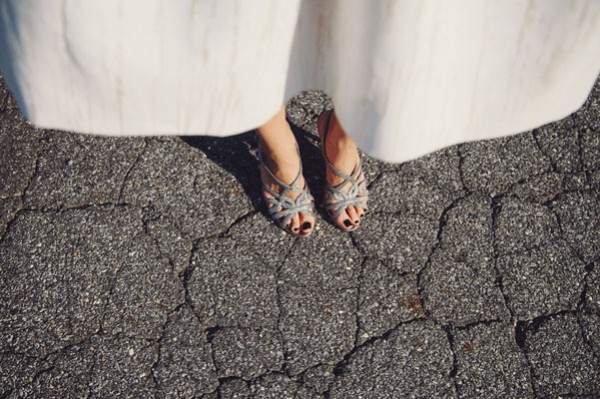 brides sparkly shoes and short dress