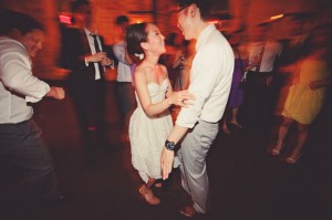 dancing at reception in short dress