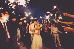 green building wedding reception with sparklers
