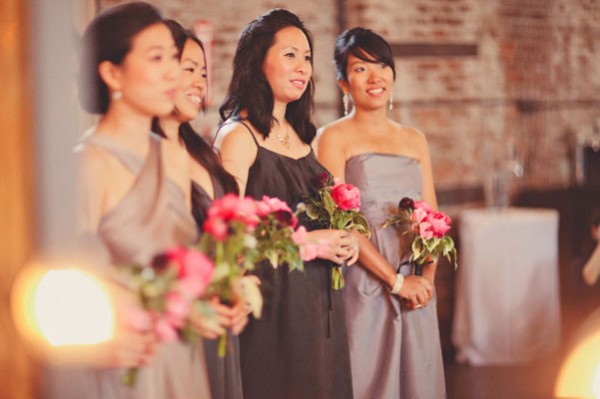 bridesmaids in grey with pink bouquets