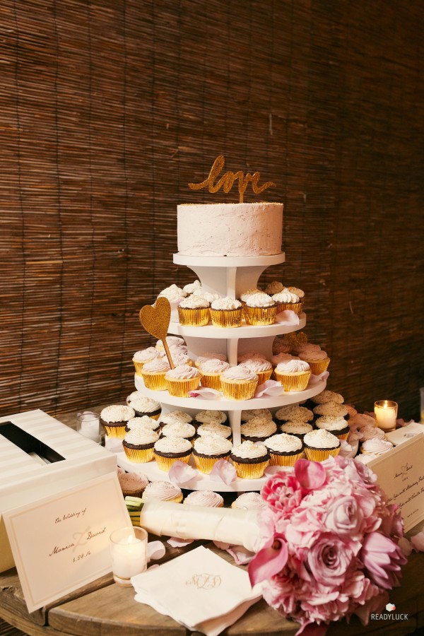 wedding cake and cupcakes