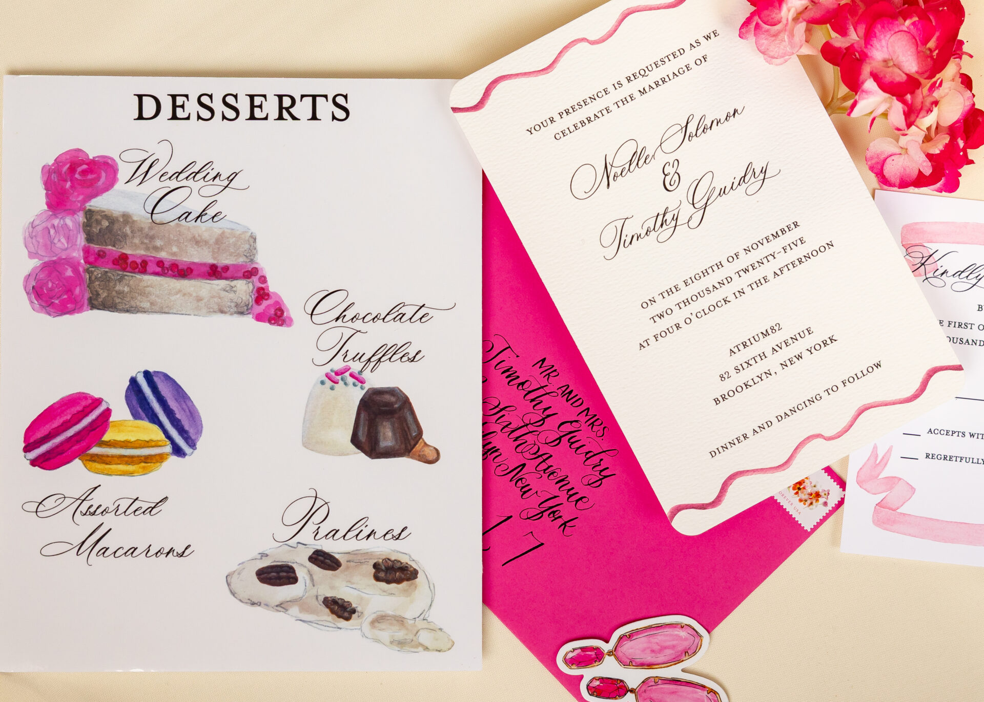 Watercolor dessert menu beside an ivory wedding invitation and a fuchsia calligraphed envelope with pink hydrangea